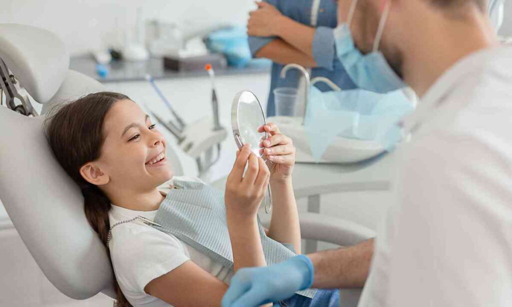 Child smiling during a dental visit at Coit Dental in Frisco, TX