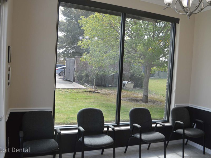 Comfortable patient waiting room at Coit Dental in Frisco, TX — relaxing seating area for dental patients
