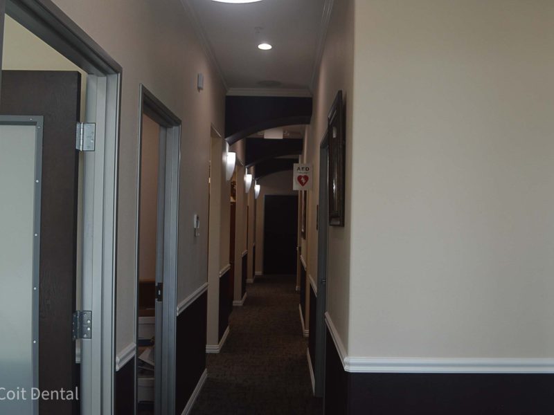Patient walk-in corridor at Coit Dental, Frisco TX — clean, welcoming hallway leading to treatment rooms