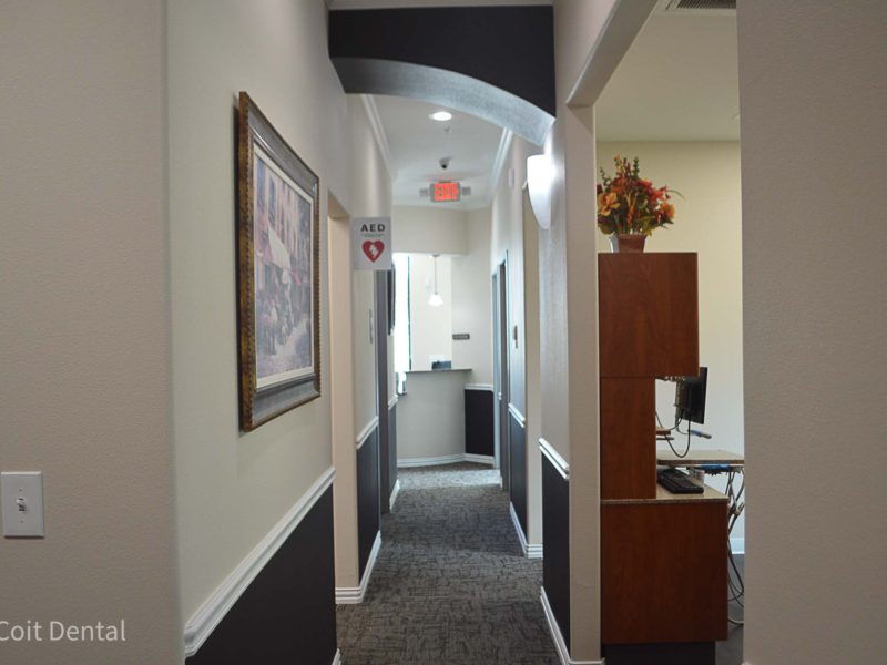 Patient walk-out corridor at Coit Dental in Frisco, TX — spacious exit hallway after treatment